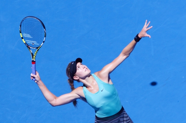Eugenie Bouchard of Canada serves against Li Na of China during the women’s singles semifinal at the 2014 Australian Open. Photograph by: GREG WOOD , AFP/Getty Images